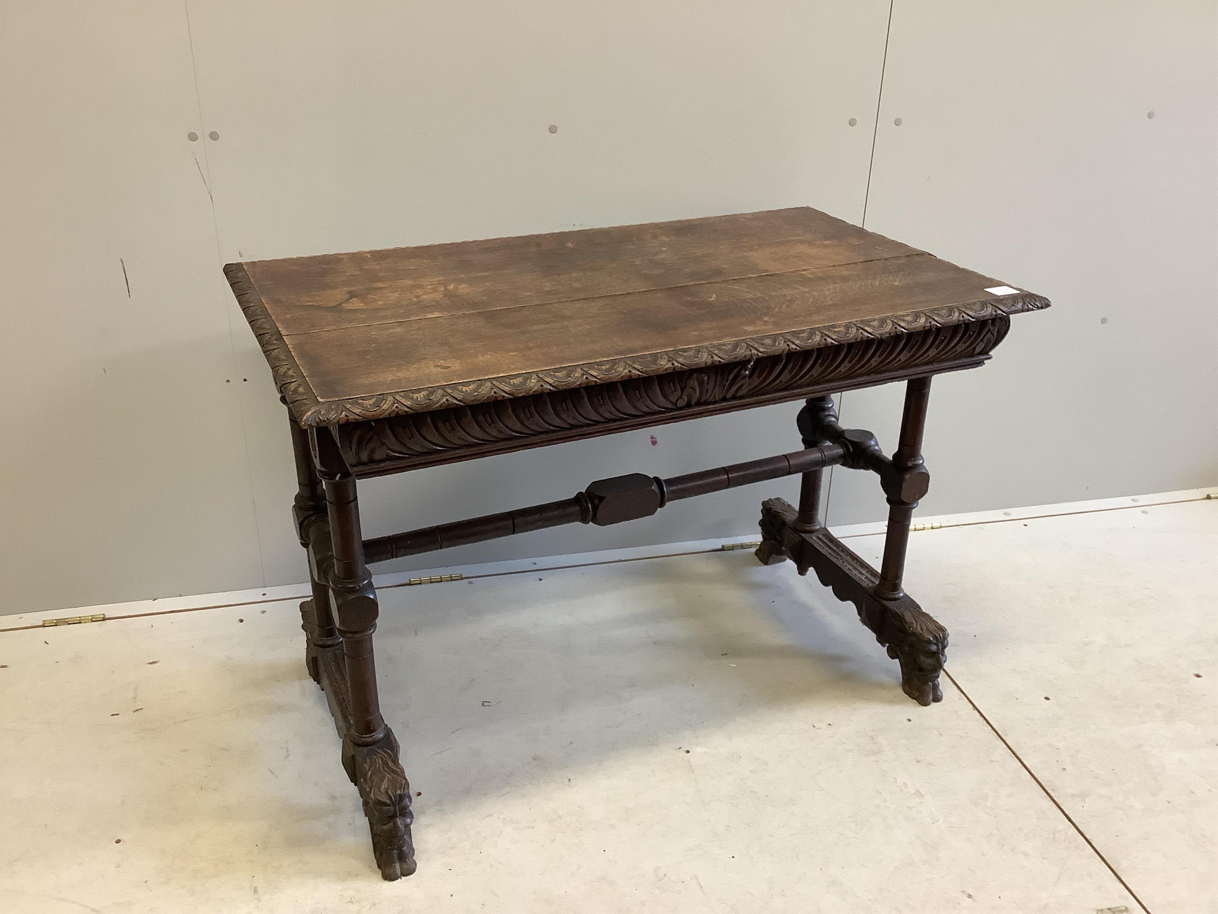 A late Victorian Flemish carved oak side table, width 108cm, depth 62cm, height 75cm. Condition - fair